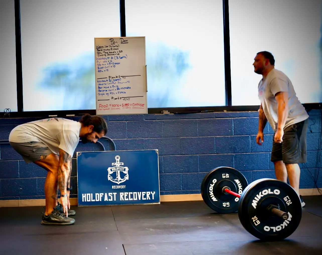 A man lifting in the Resilience Lab gym at Holdfast